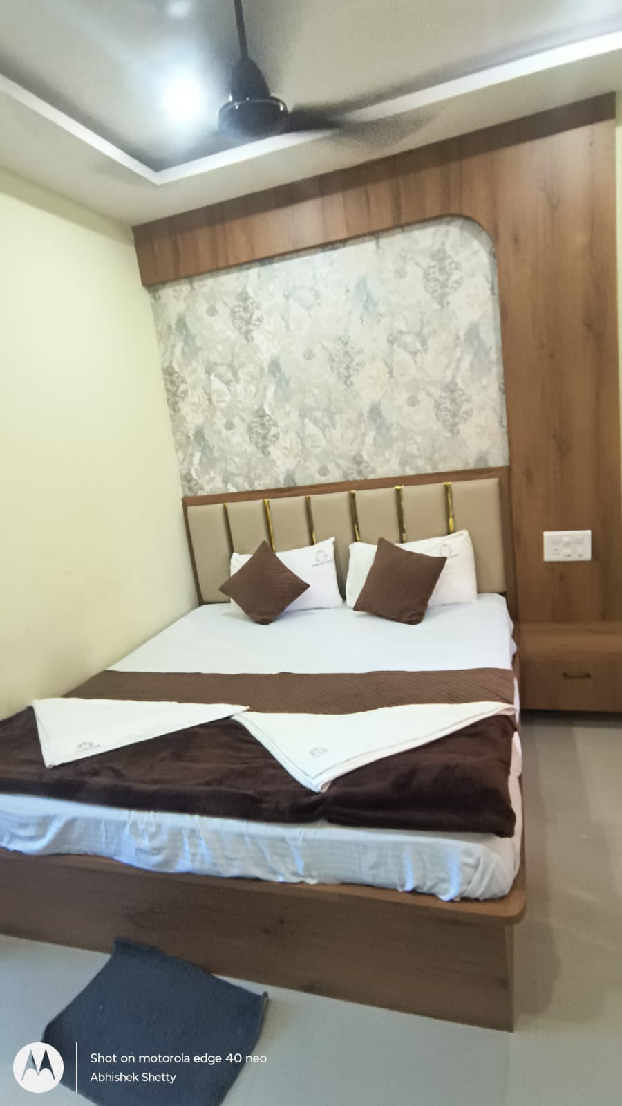 Deluxe AC Room — wood-panelled headboard