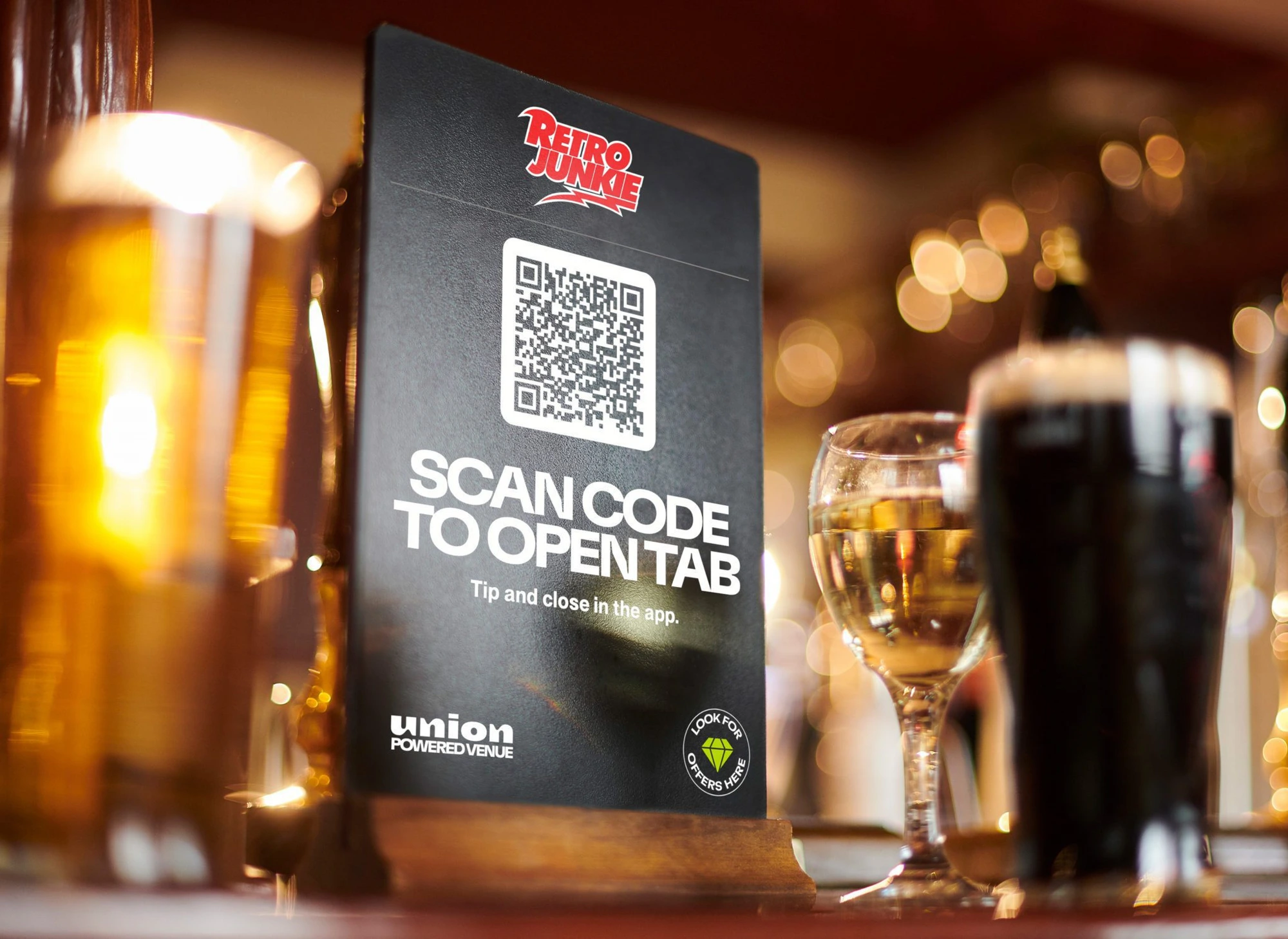 Union POS guest scanning QR code table tent to open tab and self-order at a bar
