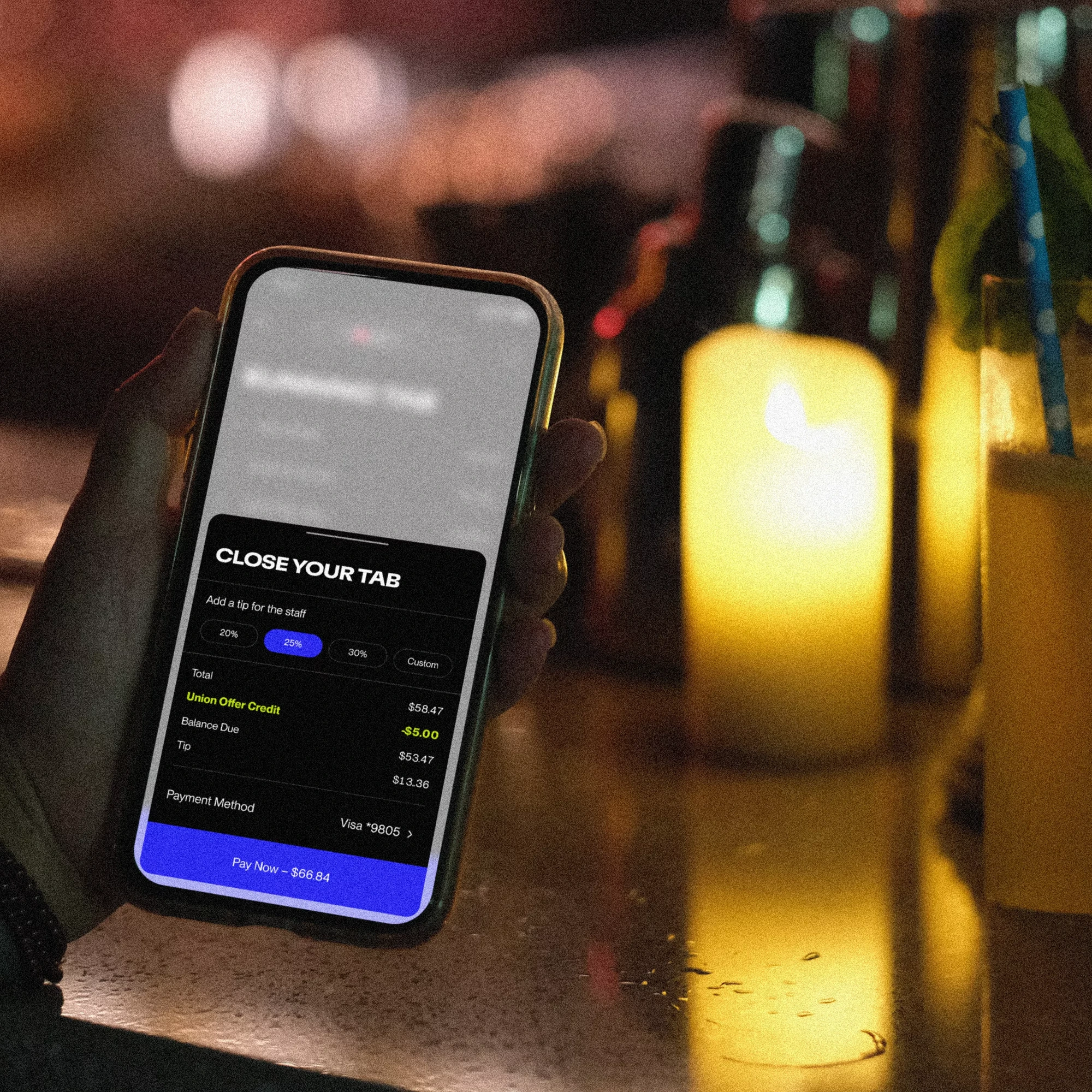 Guest using their own iPhone to close their bar tab with Union Pocket