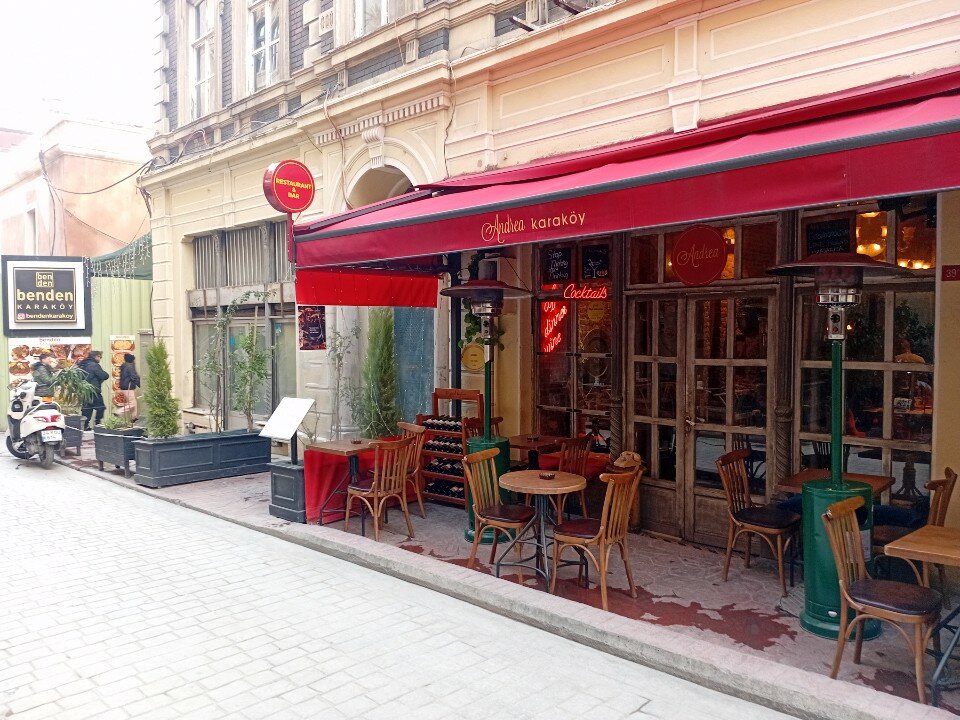 Mumhane Caddesi street scene in Karaköy — small cafés with outdoor tables a short walk from Galataport