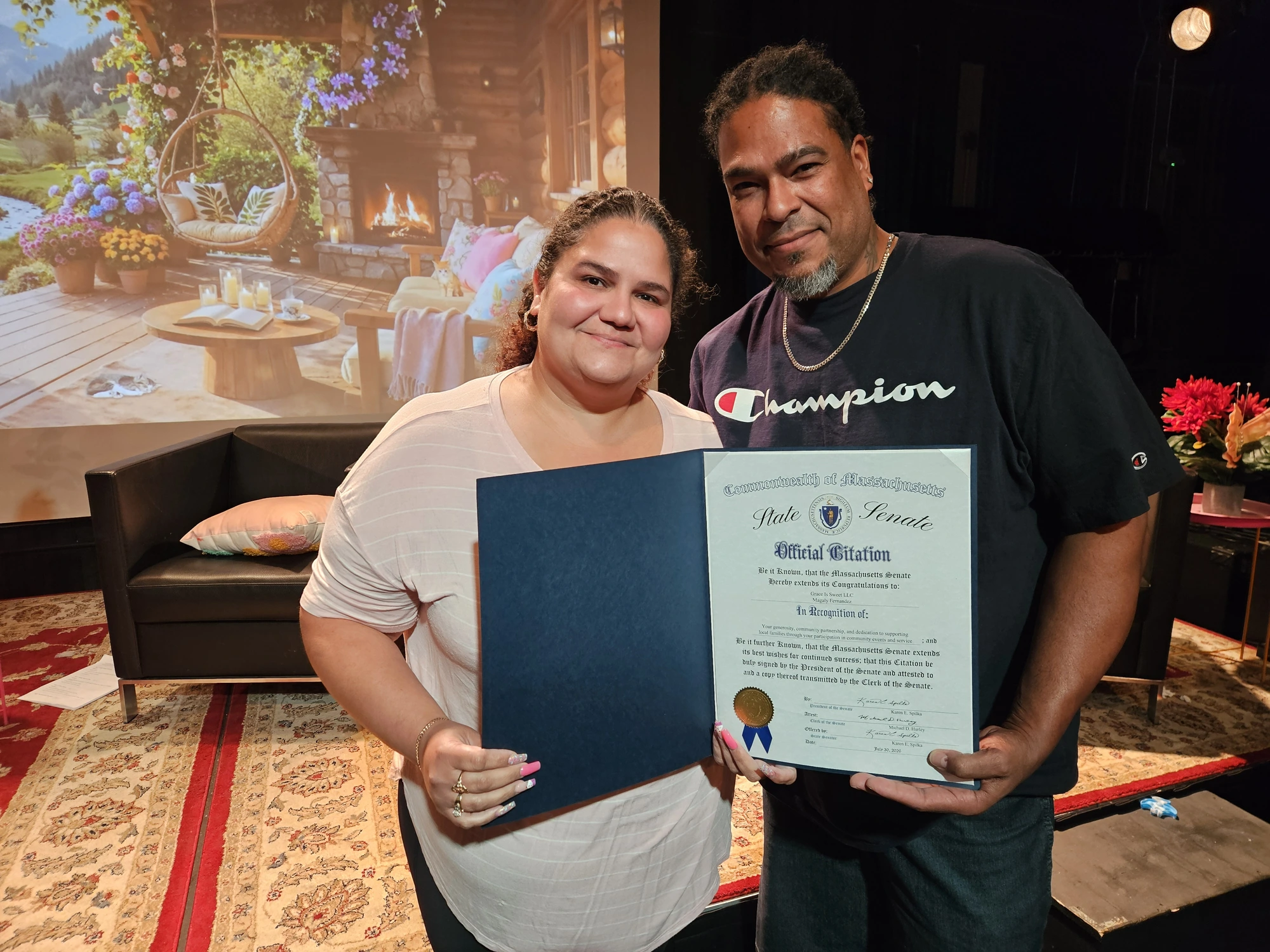 David Feliciano of New Image Barber Shop receiving a State Senate Official Citation for providing free back-to-school haircuts to Framingham youth