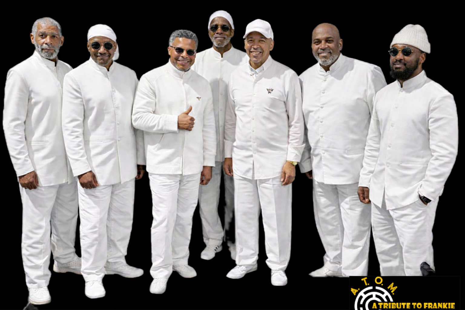 The full A.T.O.M. band in all white against a black backdrop