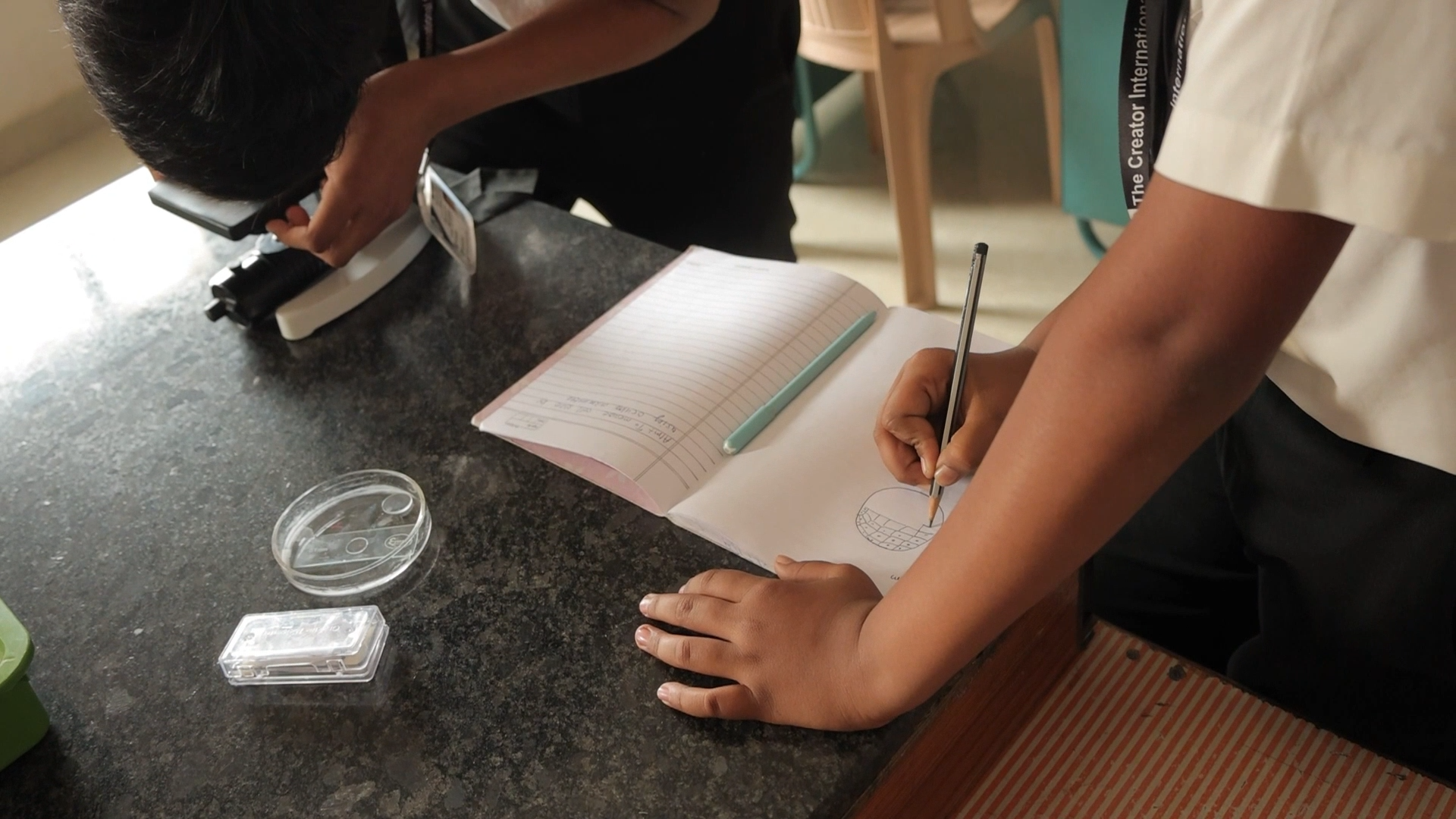 Students recording measurements