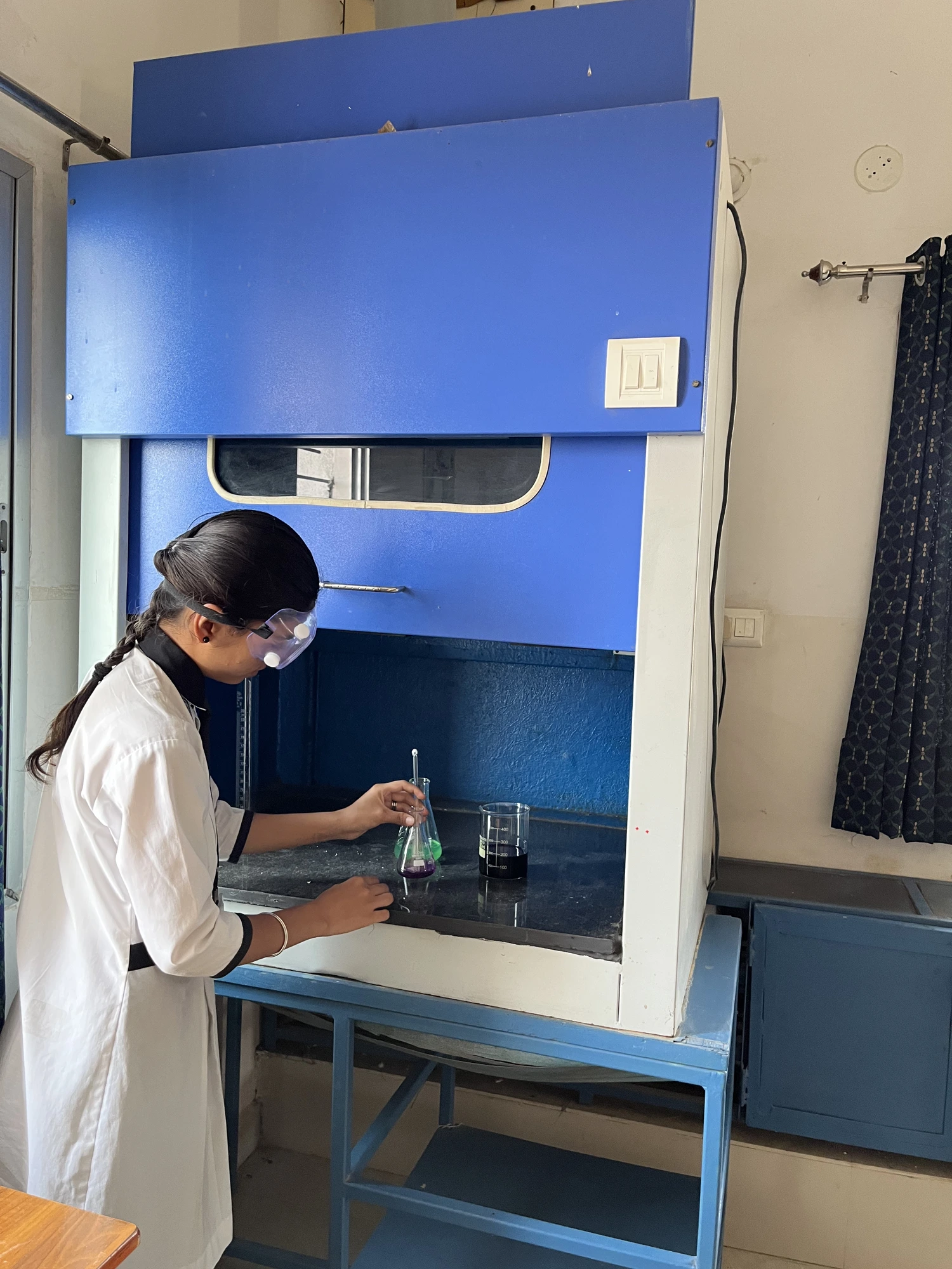 Neha — THECREATOR student conducting a chemistry experiment