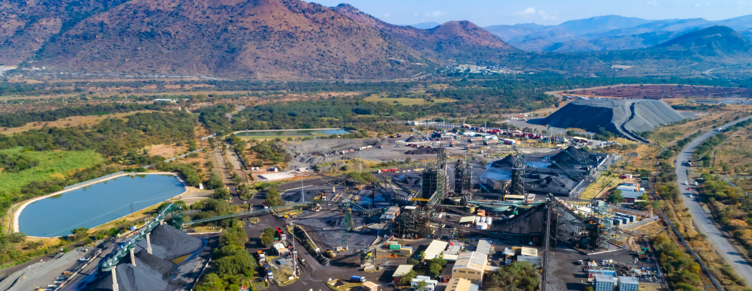 Dwarsrivier processing plant — conveyor systems and stockpiles against the Steelpoort valley