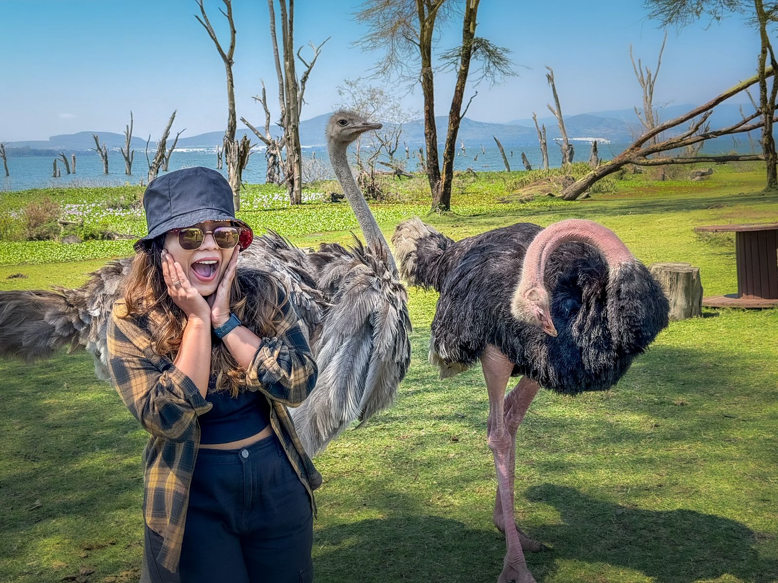 Aishwarya laughing next to an ostrich at Lake Naivasha