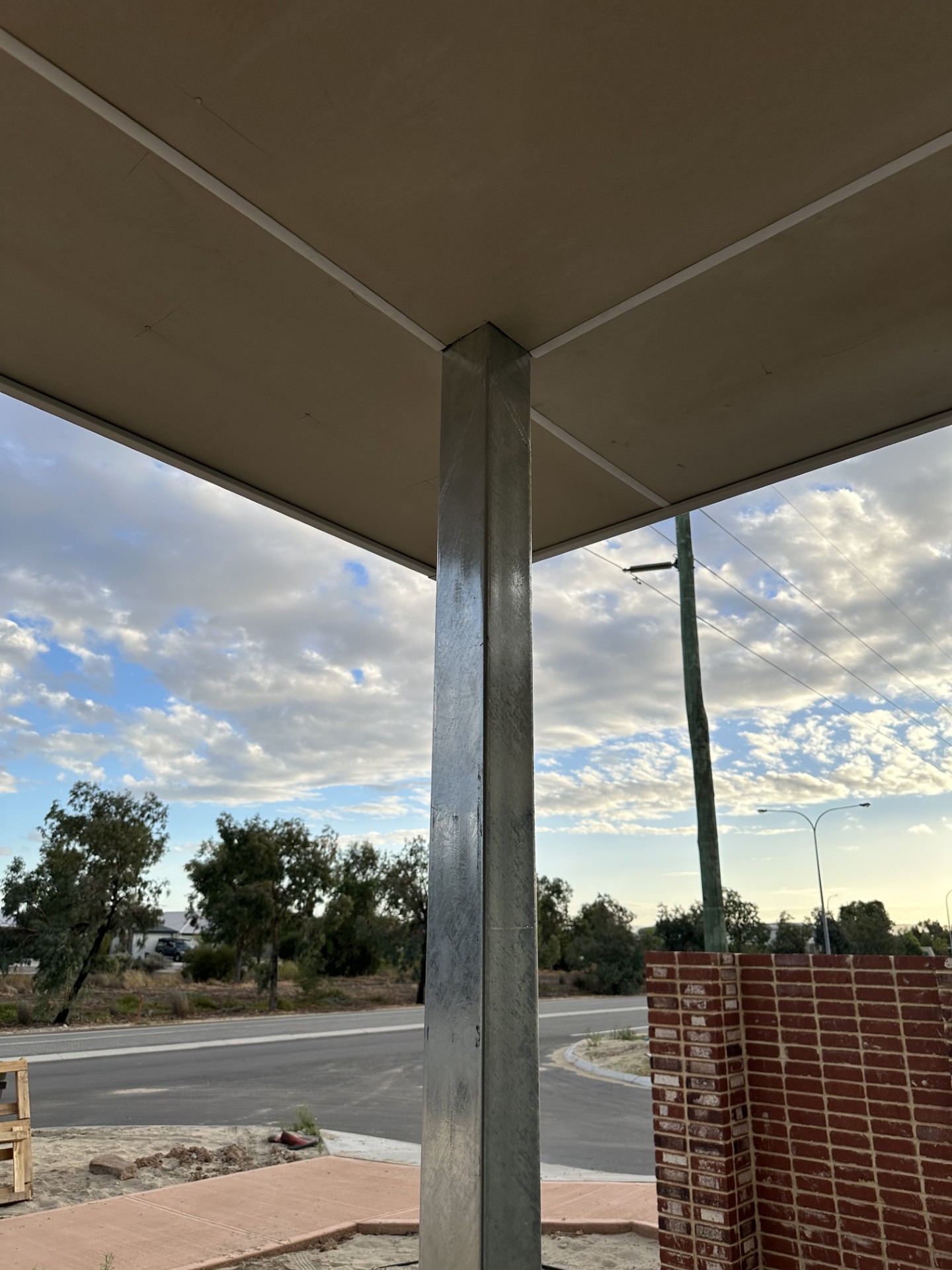 Finished porch ceiling with structural post by A E Carpentry