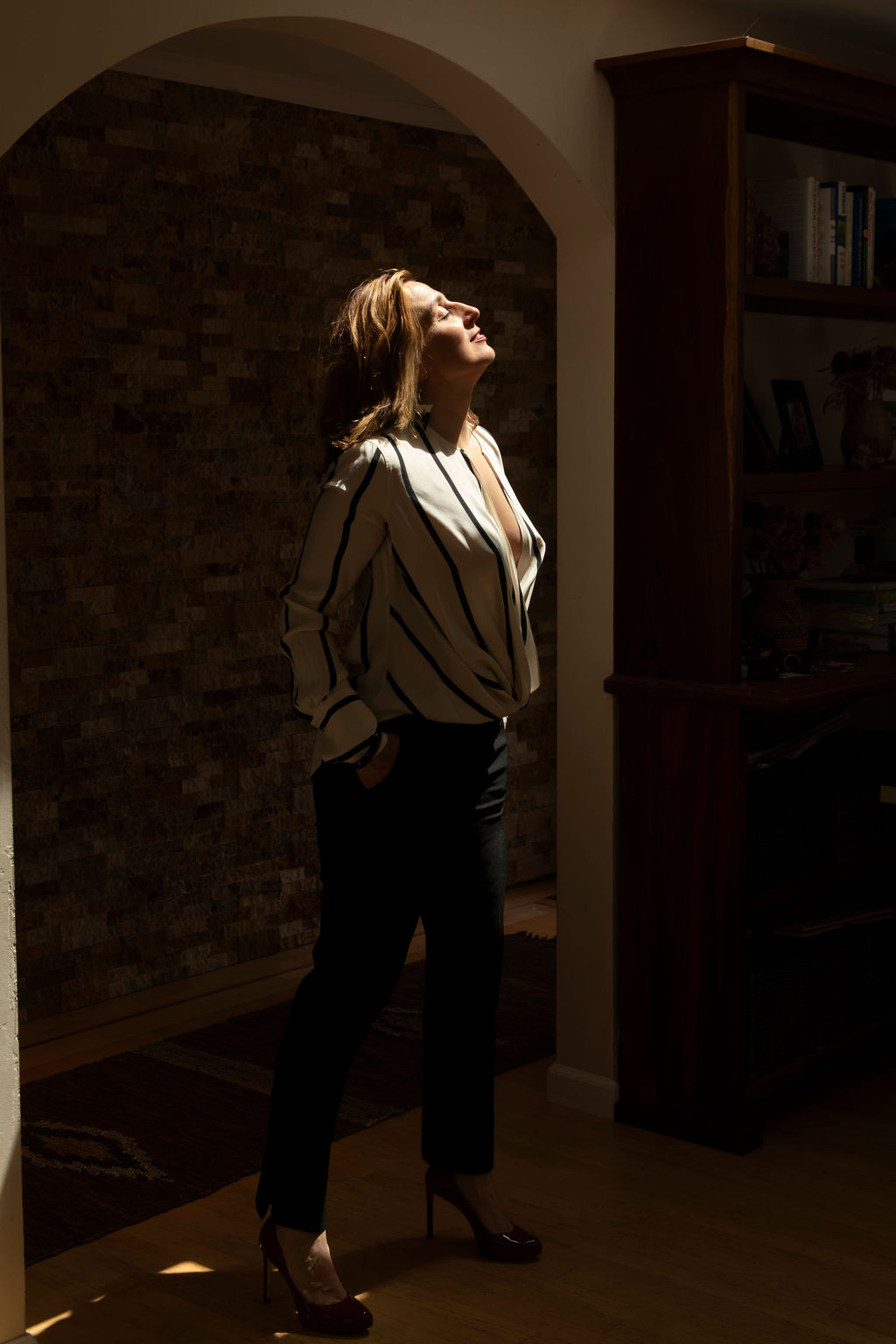 A woman turning her face to the light