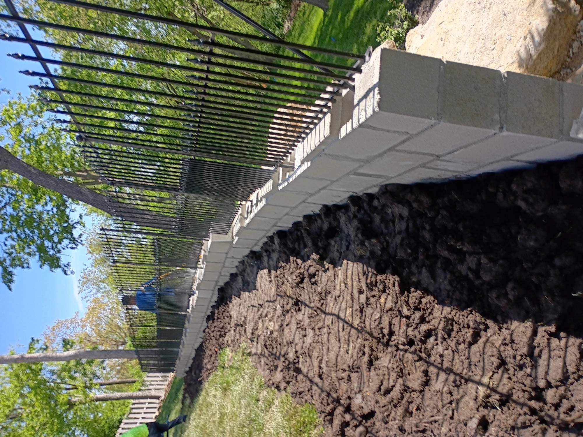 Black metal wrought iron fence installation Kansas City