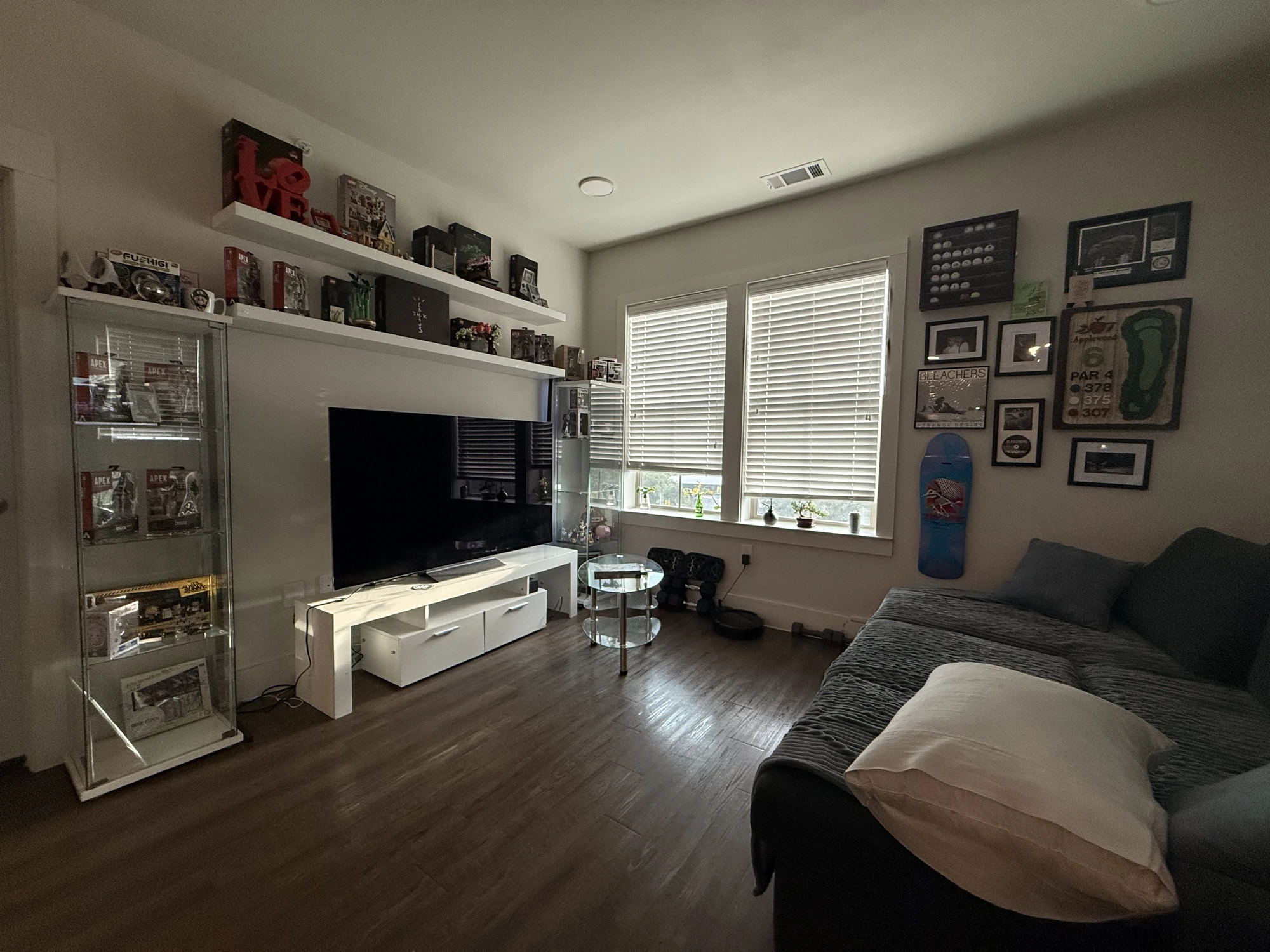 Original cluttered phone photo of a living room before AI real estate photo editing